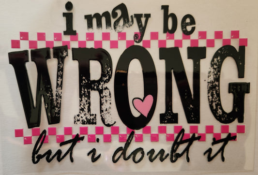 Decorative sign with text 'i may be WRONG but i doubt it' on a pink checkered background.